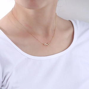 Elegant S925 silver infinity pendant necklace with cubic zirconia on a gold chain