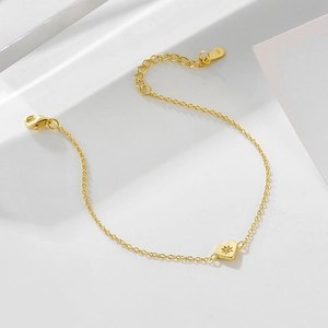 925 sterling silver 14K gold plated bracelet featuring a heart pendant with star detail