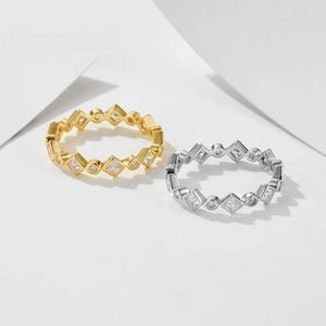 Geometric eternity rings in gold and silver with rhombus and round zircon settings