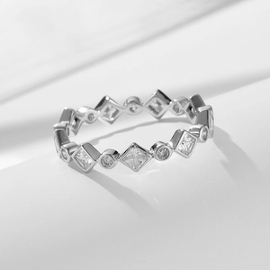 Elegant geometric silver ring featuring alternating square and round cubic zirconia stones