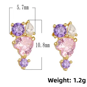 Detailed view of pink heart zircon earrings with size specs 5.7mm by 10.8mm