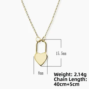 Detail of gold heart lock pendant showing dimensions 15.5mm by 8mm on a fine chain