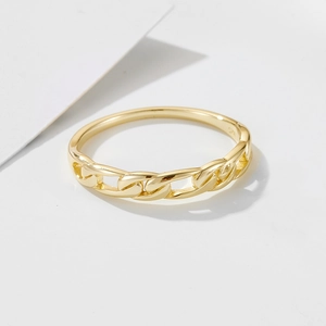 Close-up of golden S925 sterling silver ring with Cuban chain link and smooth band design