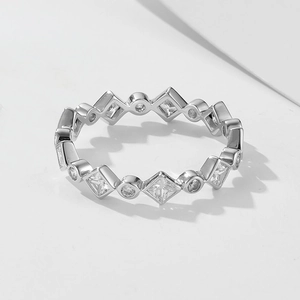 Close-up of geometric sterling silver ring with round and rhombic cubic zirconia stones
