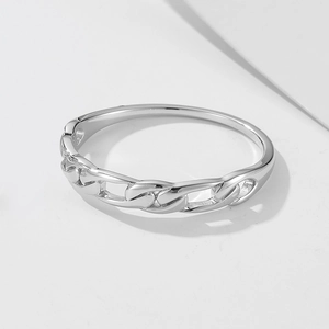 Detailed view of silver chain-link ring with modern hollowed Cuban style design