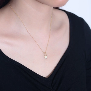 Elegant gold S925 sterling silver heart lock necklace worn on a female model