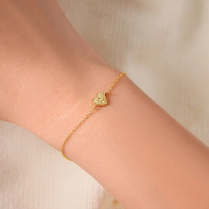 14K gold plated 925 silver heart bracelet with star engraving and white crystal on wrist