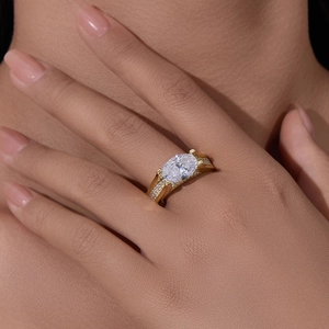 Close-up of 4.5 carat oval zircon ring with pavé diamonds on wide gold band