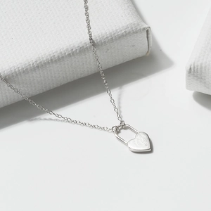 Minimalist S925 sterling silver necklace with a heart-shaped brushed lock pendant