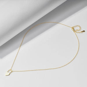 Detailed view of the lobster clasp and adjustable cable chain on the gold heart lock necklace