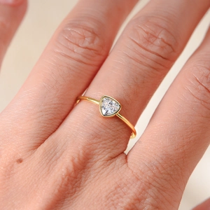 Minimalist 14k gold plated 925 silver ring featuring a triangle cut diamond on hand