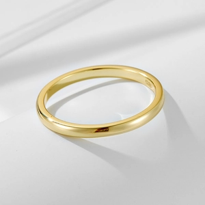 Close-up of golden S925 sterling silver ring band showing the hallmark and smooth finish