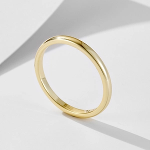 Detailed close-up of S925 hallmark on a minimalist gold-plated silver ring band