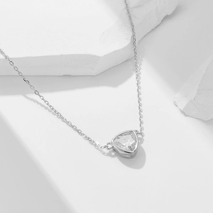 Minimalist S925 sterling silver necklace with a geometric triangle zircon pendant on a stone
