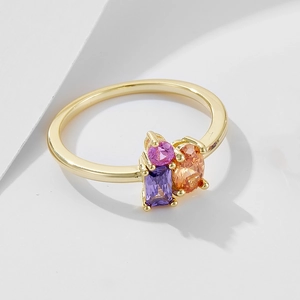 Detail of S925 silver ring with rectangular and oval colored cubic zirconia in claw setting