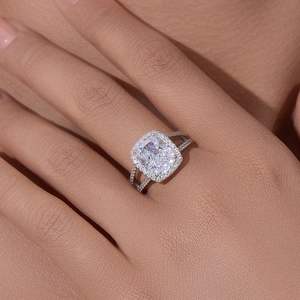 Luxury 925 sterling silver cushion cut halo ring worn on hand with split shank detail