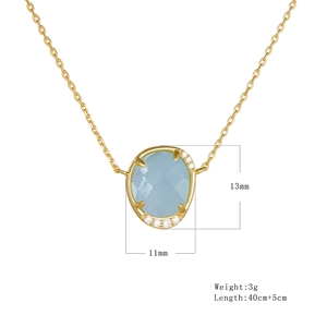 Detailed view showing 13mm oval aquamarine pendant size on 45cm gold chain