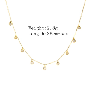 Detailed size specifications for the gold tassel necklace with zircon charms and length info