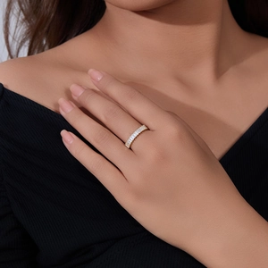 Detail of 925 silver gold plated ring with rectangular zircons on model hand