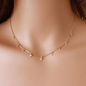 925 silver gold-plated necklace featuring multiple round zircon pendants on a model