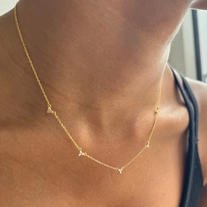 Detailed close-up of S925 silver gold-plated clover necklace with micro-set zircon accents