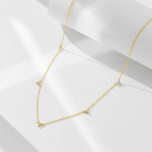 Minimalist s925 silver clover necklace with five zircon pendants on a golden chain