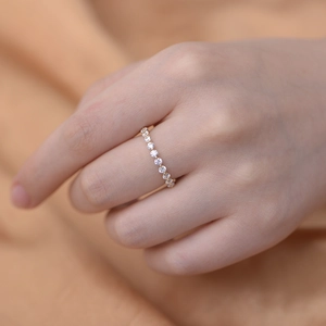 Minimalist S925 sterling silver eternity ring with 2.5mm cubic zirconia on model finger