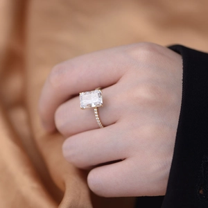 Close-up of S925 silver ring with rectangular ice-cut zircon on elegant bronze silk