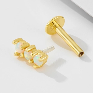 Detail of 925 silver flat back labret with three white opals and threaded post structure