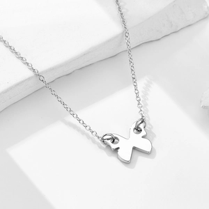 Minimalist S925 sterling silver butterfly pendant necklace on a natural stone background
