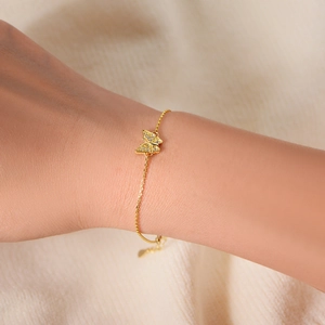Elegant S925 sterling silver butterfly bracelet with sparkling zircon stones on a model