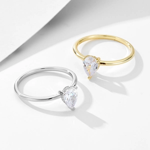 Classic S925 silver pear cut zircon ring in gold and silver finish on white background