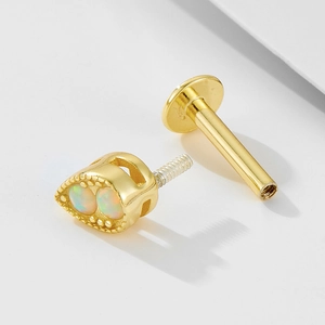 Detail of 925 silver teardrop opal stud earring with gold plating and internal threading