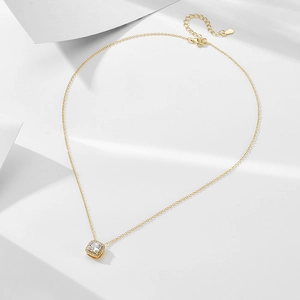 Detail of S925 silver necklace with square zircon pendant on white geometric background