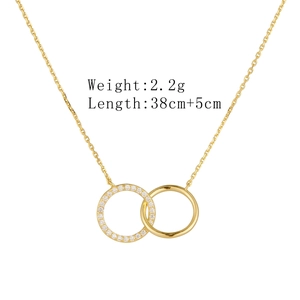 Detail of interlocking circles necklace with micro-pave crystals and polished gold finish