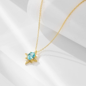 Collana in argento S925 con pendente a stella, topazio blu e dettagli scintillanti fini