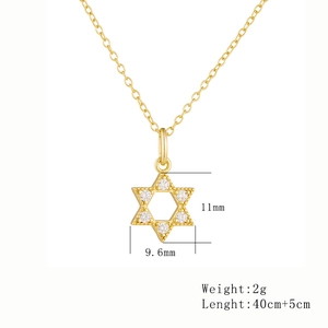 Detailed view of 14k gold plated 925 silver hexagram pendant with clear zircons