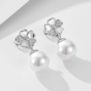 Elegant S925 silver pearl drop earrings with sparkling diamond clover flower design