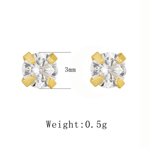Macro shot of 3mm round zircon stud earrings with gold four-prong setting and 0.5g weight