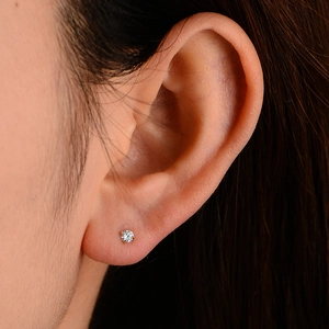 S925 sterling silver 3mm round zircon stud earring with four-claw setting on earlobe