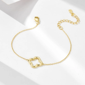 Close-up of S925 sterling silver stamp on a gold-plated hollow clover bracelet clasp