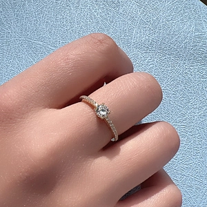 Minimalist S925 sterling silver ring with a large round diamond and pave setting gems