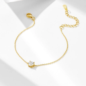 Detailed view of S925 silver gold bracelet with single zircon and lobster clasp