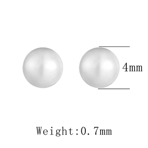 Detail view of 4mm round bead silver stud earrings with high polished glossy finish