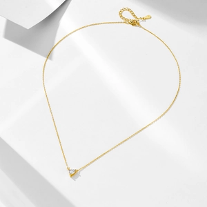 Macro detail of S925 sterling silver heart-cut zircon pendant with adjustable gold chain