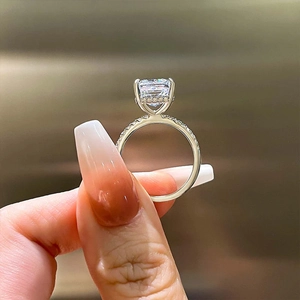 Macro view of radiant cut S925 silver ring set with micro-pave diamonds and hidden halo