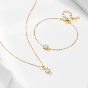 Macro detail of S925 sterling silver stamp on golden bracelet chain with zircon