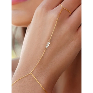 Elegant gold S925 silver finger bracelet featuring three white pearls on a fine chain