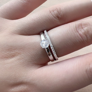 Elegant S925 sterling silver ring set with six-prong zircon stone on woman's finger