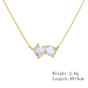 Detail of gold pendant with emerald and pear cut cubic zirconia on 40cm chain